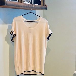 Lightweight, ivory sweater with black trim